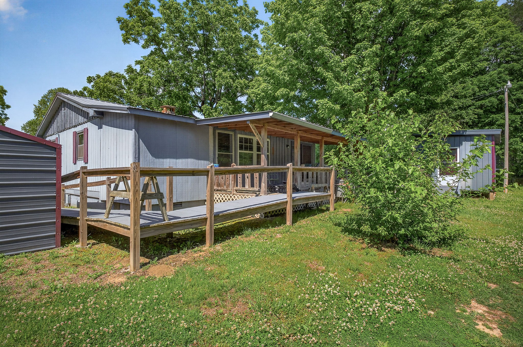 1720 Besstown Road Beersheba Springs, TN 37305 - Photo 35 of 75 a view of a house with wooden fence and a yard