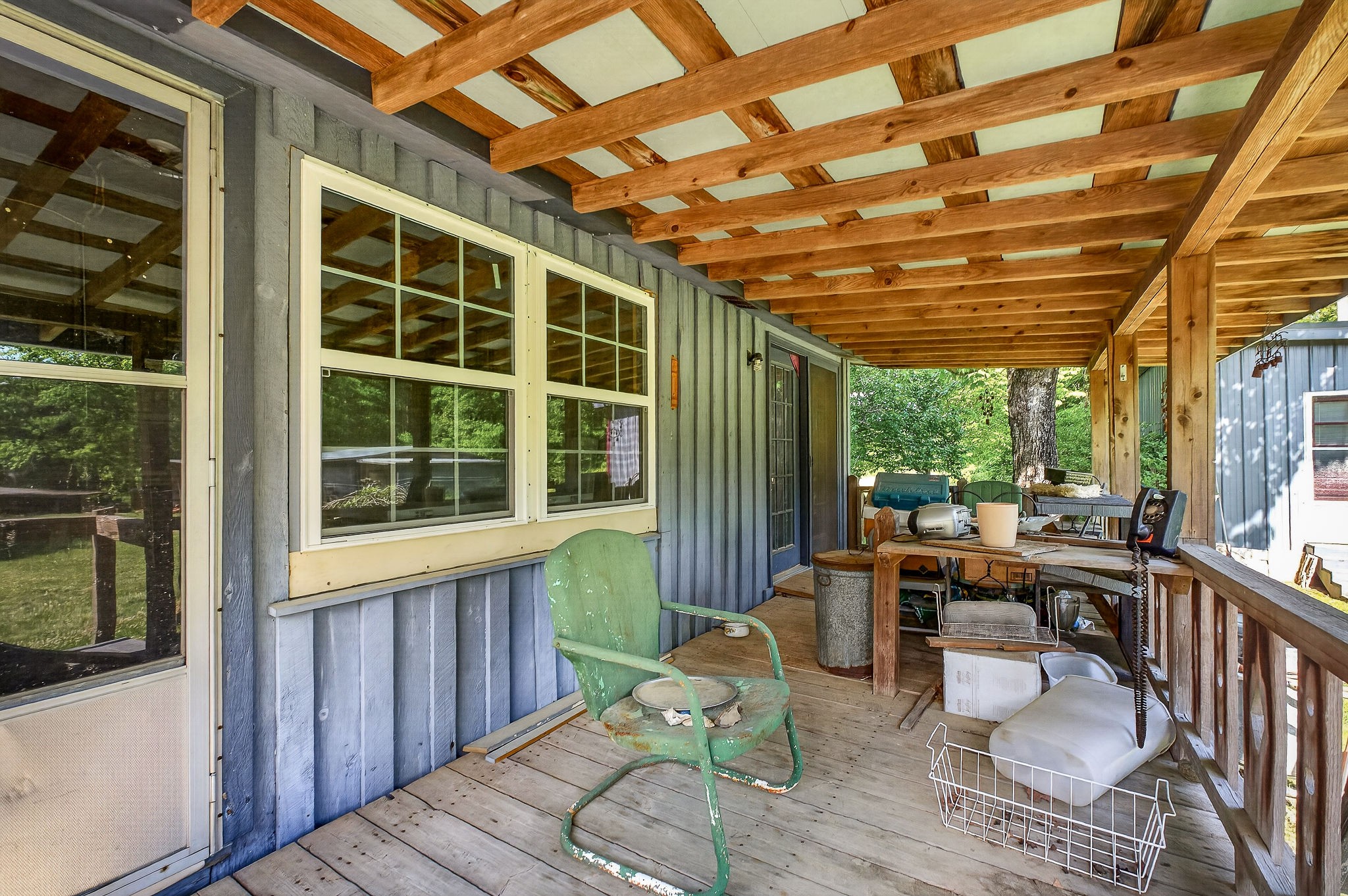 1720 Besstown Road Beersheba Springs, TN 37305 - Photo 37 of 75 a view of a porch with chairs and couches