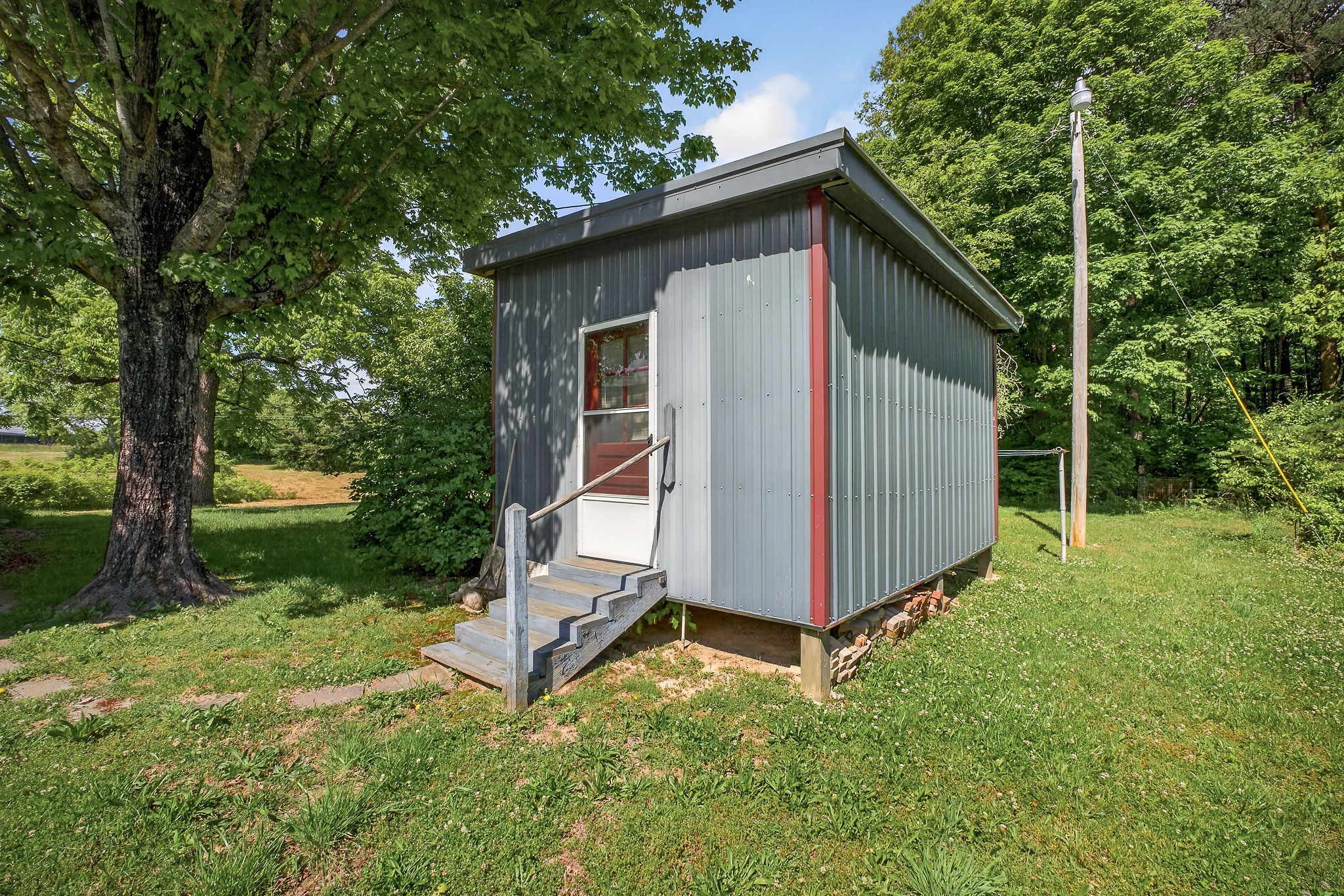 1720 Besstown Road Beersheba Springs, TN 37305 - Photo 40 of 75 a view of backyard with large trees and wooden fence