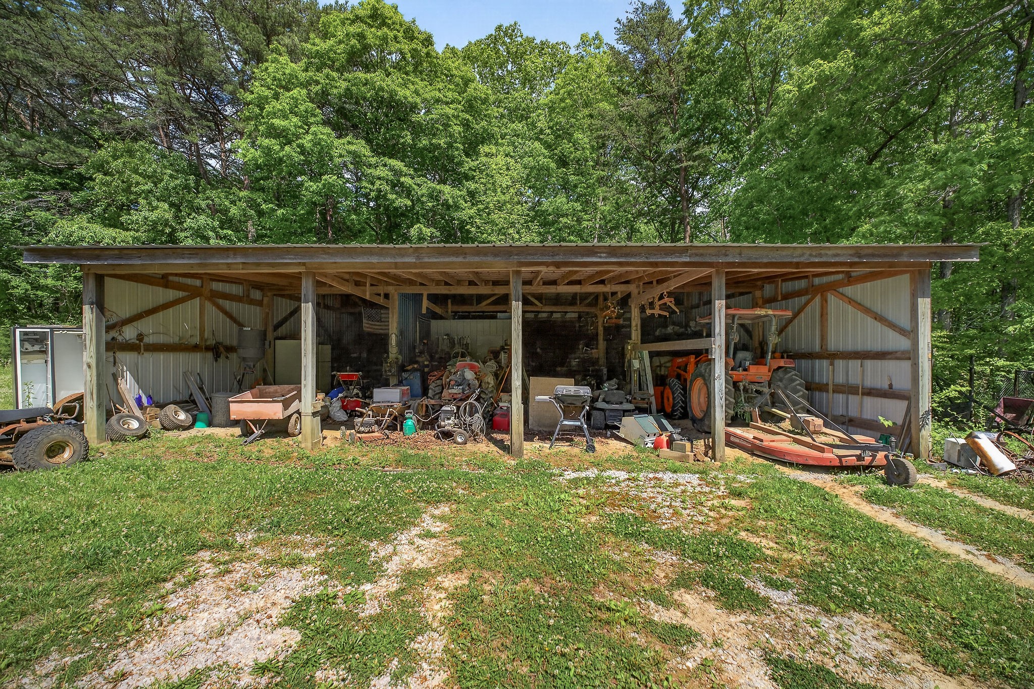 1720 Besstown Road Beersheba Springs, TN 37305 - Photo 43 of 75 a view of a backyard with table and chairs and a large tree