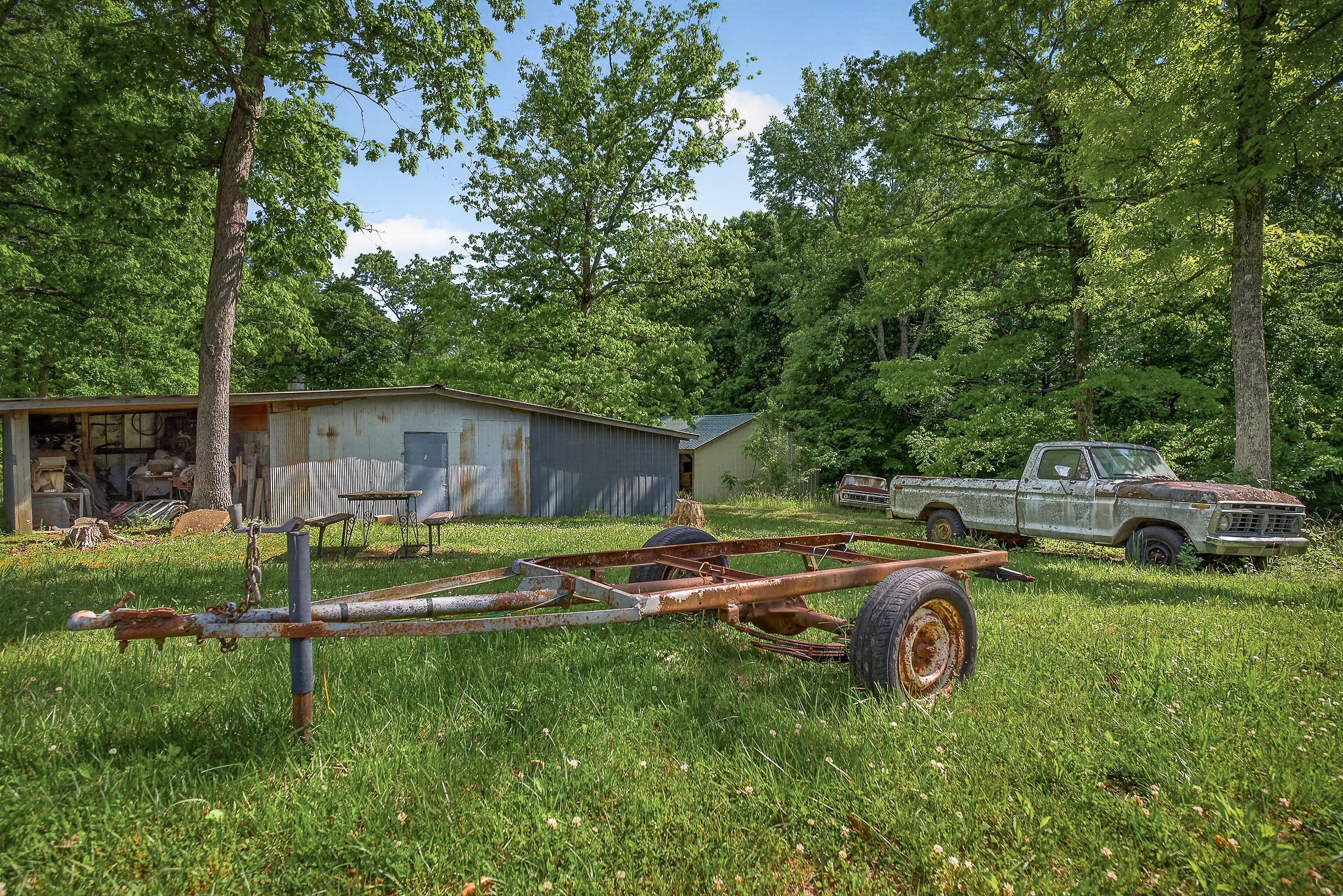 1720 Besstown Road Beersheba Springs, TN 37305 - Photo 52 of 75 a view of a backyard with table and chairs and a fire pit
