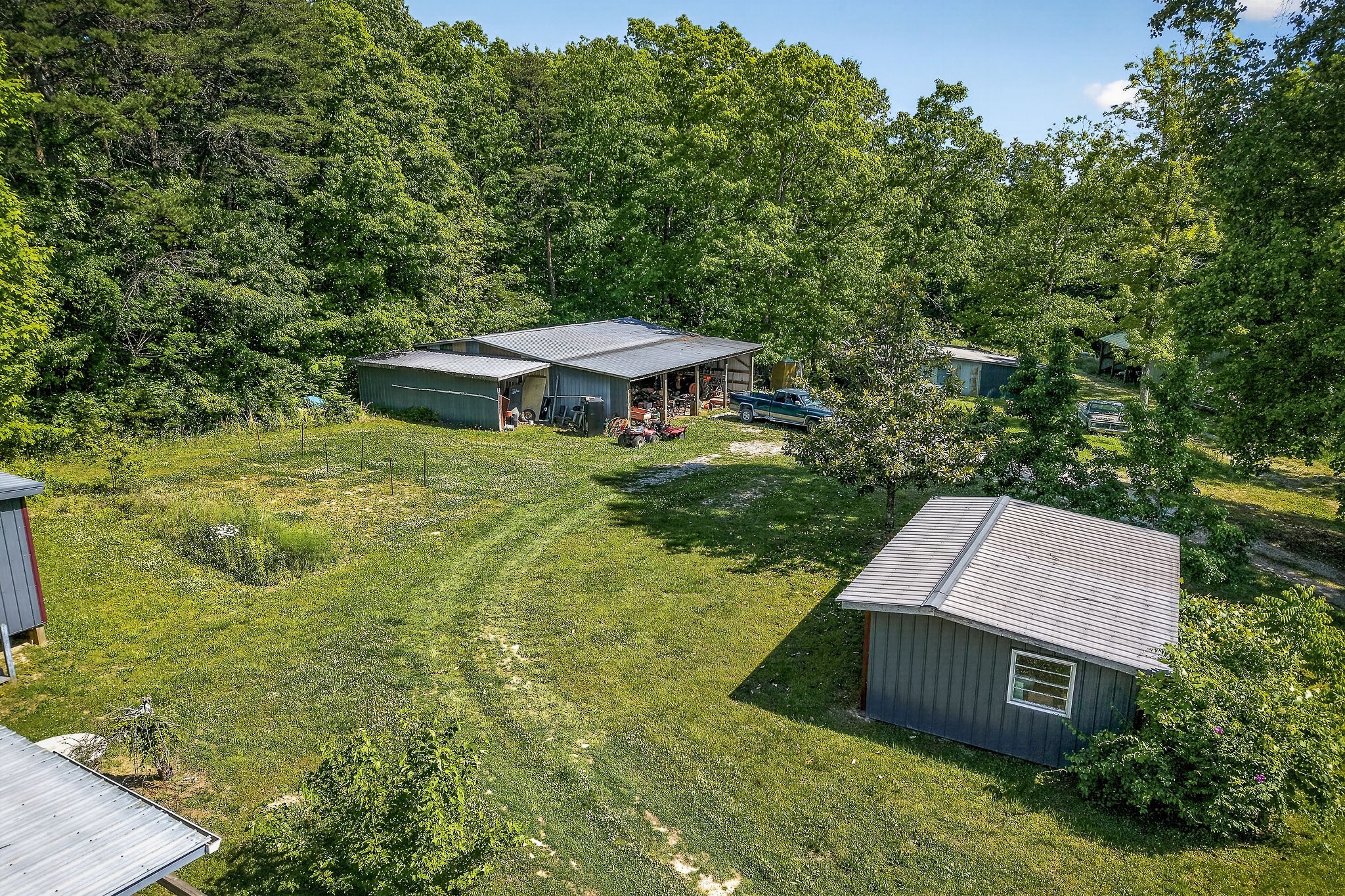 1720 Besstown Road Beersheba Springs, TN 37305 - Photo 8 of 75 an aerial view of a house with swimming pool and trees all around
