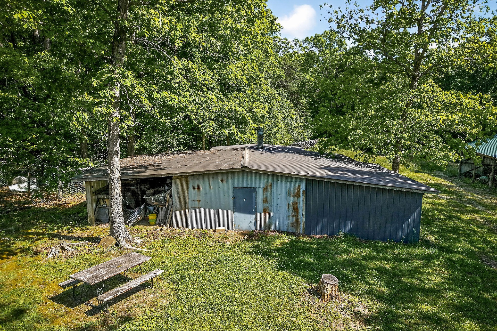 1720 Besstown Road Beersheba Springs, TN 37305 - Photo 9 of 75 a view of a house with a yard patio and a tree