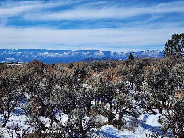 a view of mountain with sunset