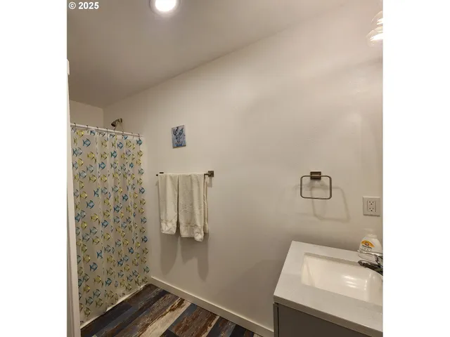 a bathroom with a sink and mirror