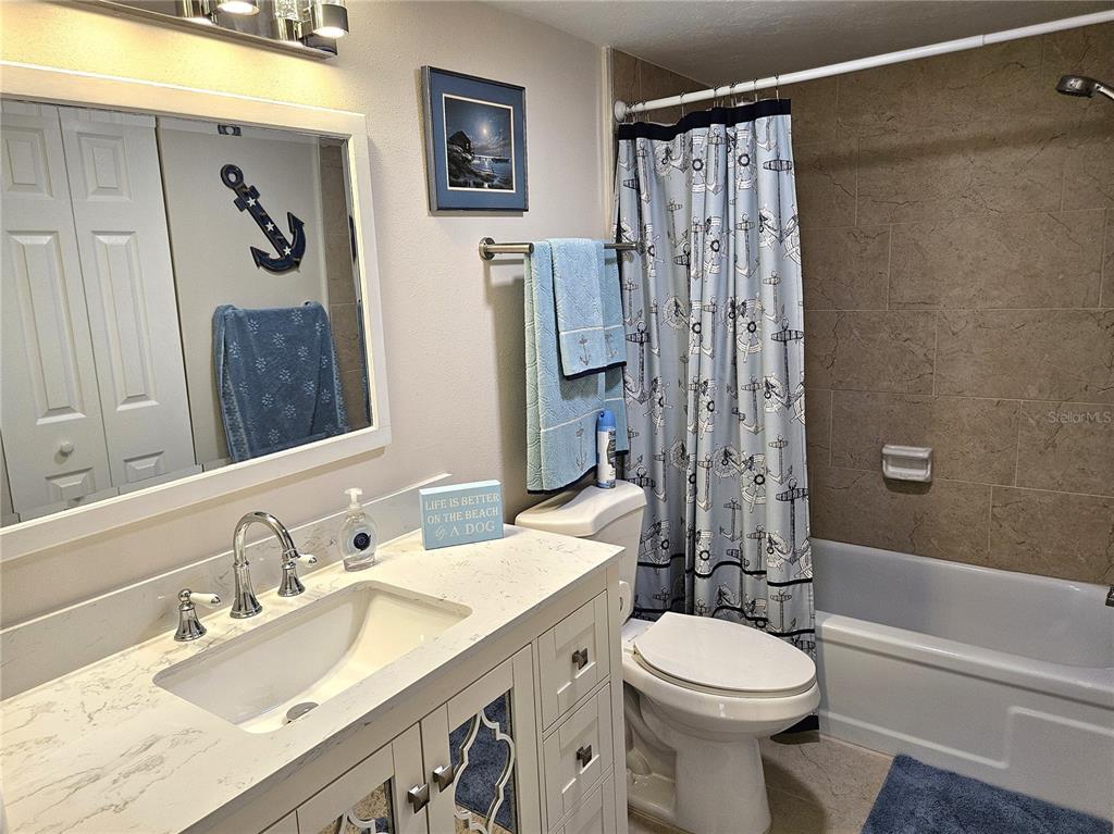 519 Albee Farm Road, Unit 114 Venice, FL 34285 - Photo 15 of 21 a bathroom with a sink a toilet and shower