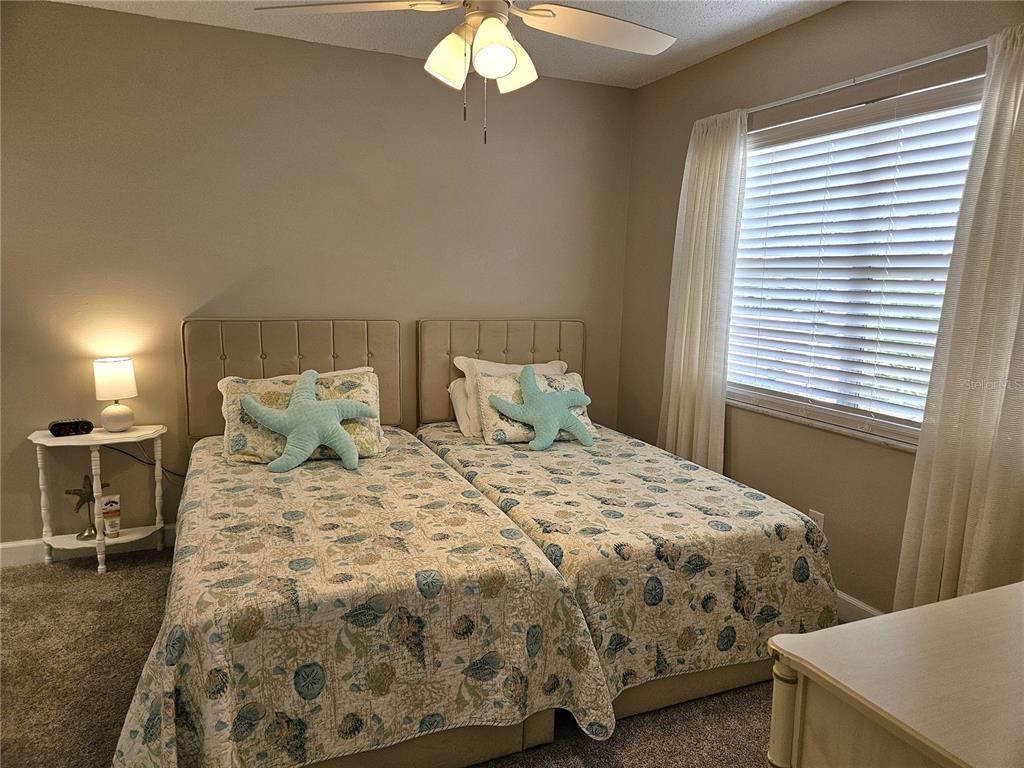 519 Albee Farm Road, Unit 114 Venice, FL 34285 - Photo 16 of 21 a bedroom with a bed and a window