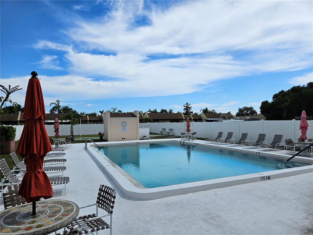 519 Albee Farm Road, Unit 114 Venice, FL 34285 - Photo 2 of 21 a view of a swimming pool with a terrace