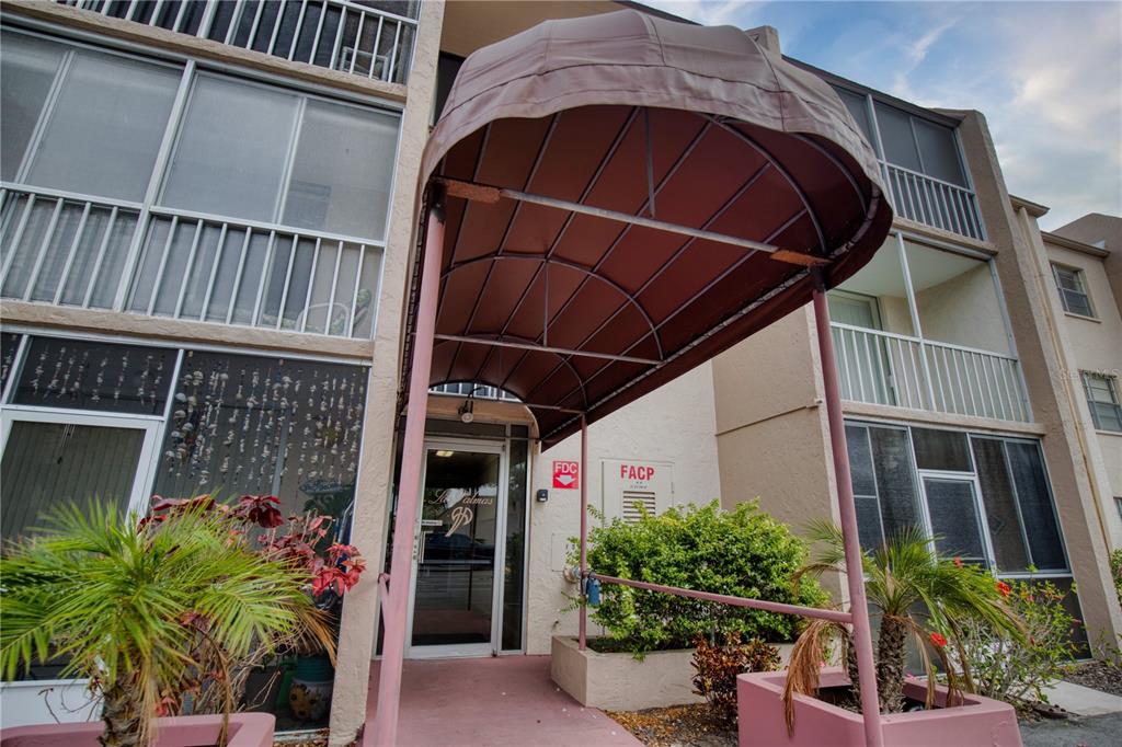 519 Albee Farm Road, Unit 114 Venice, FL 34285 - Photo 3 of 21 a front view of a house with plants