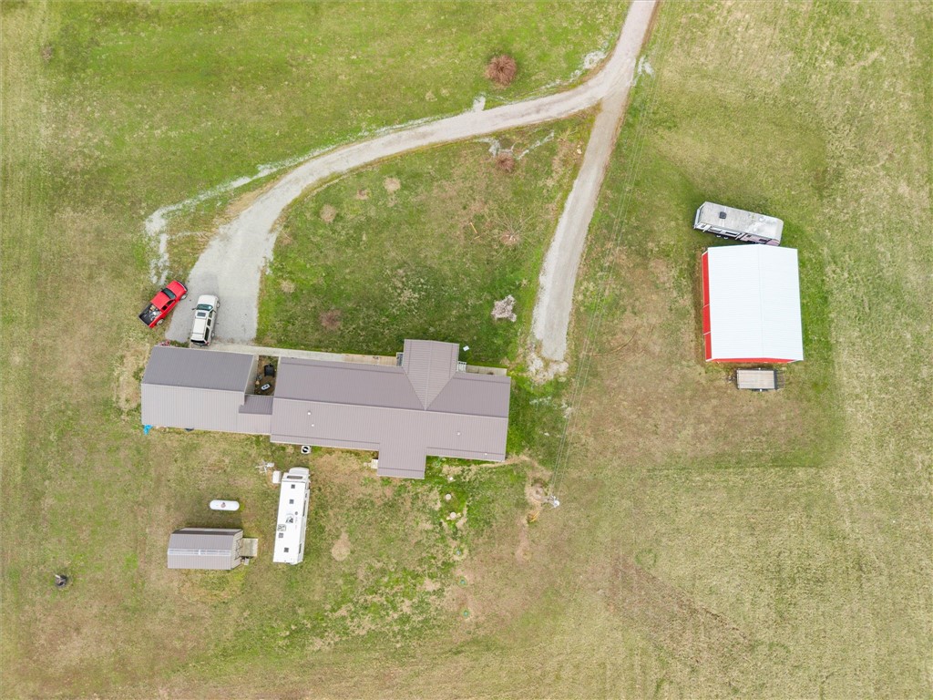 1926 Fairview Road Peebles, OH 45660 - Photo 7 of 44 An aerial view showcases this expansive property with a charming home and detached structures.
