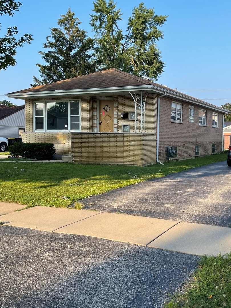 10737 Princess Avenue Chicago Ridge, IL 60415 - Photo 2 of 3 a front view of a house with a yard