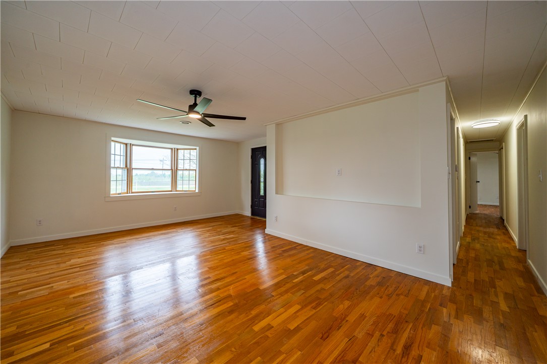 11296 Pansing Road Brookville, OH 45309 - Photo 3 of 53 This inviting living space features gleaming hardwood floors and ample natural light, creating a bright ambiance.