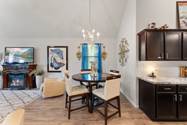 a view of a livingroom with furniture flat screen tv and outdoor view