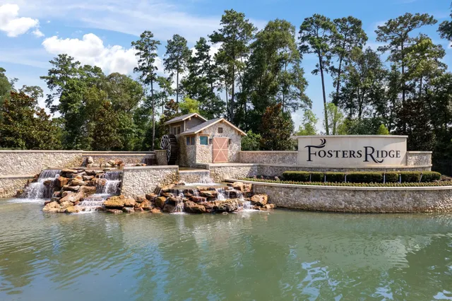 an aerial view of a house with swimming pool and garden