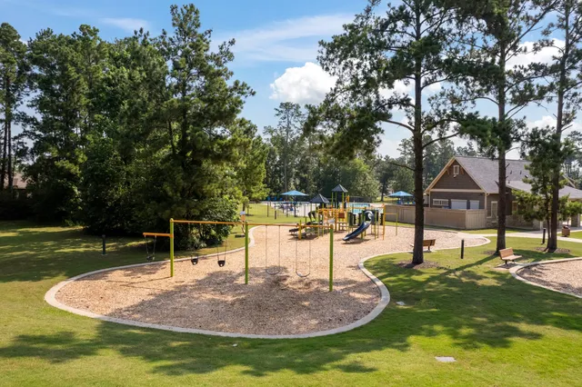 swimming pool view with a seating space