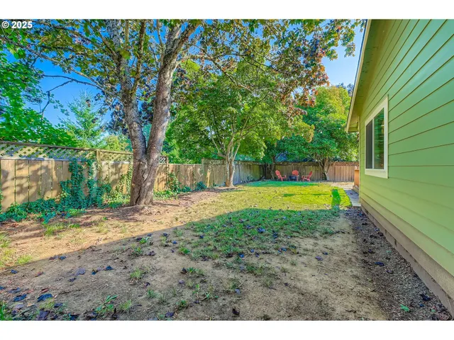 a view of a swimming pool with a yard
