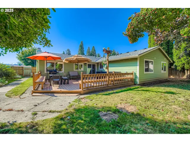 a view of a house with a yard porch and sitting area