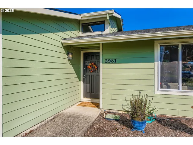a view of a house with a door and a window
