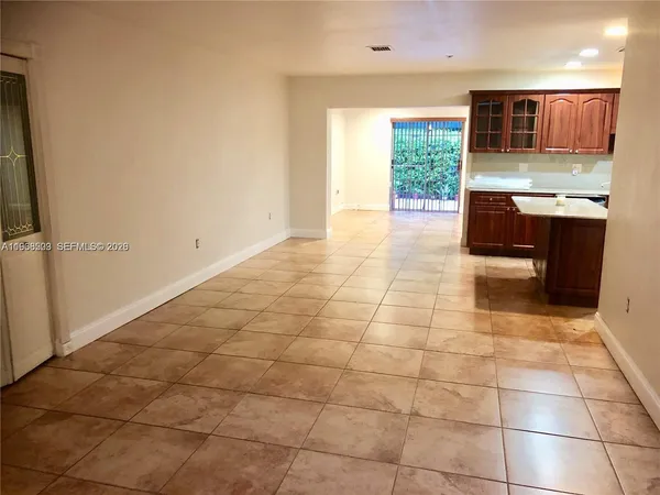 a kitchen with stainless steel appliances a sink and a microwave