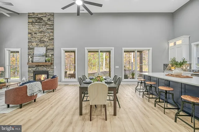 a bathroom with a granite countertop sink toilet and mirror