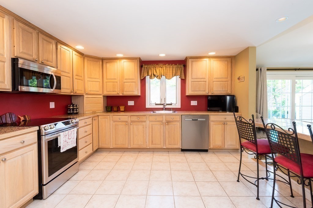 8 Pyburn Road Lynnfield, MA 01940 - Photo 16 of 35 a kitchen with a stove top oven sink and cabinets