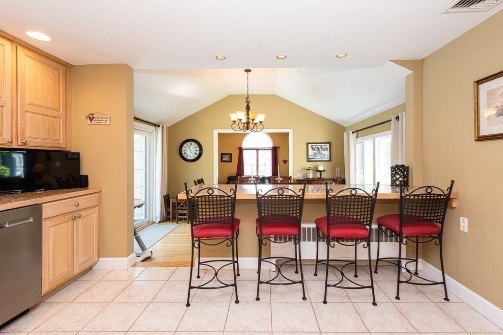 8 Pyburn Road Lynnfield, MA 01940 - Photo 17 of 35 a living room with furniture a flat screen tv and a window