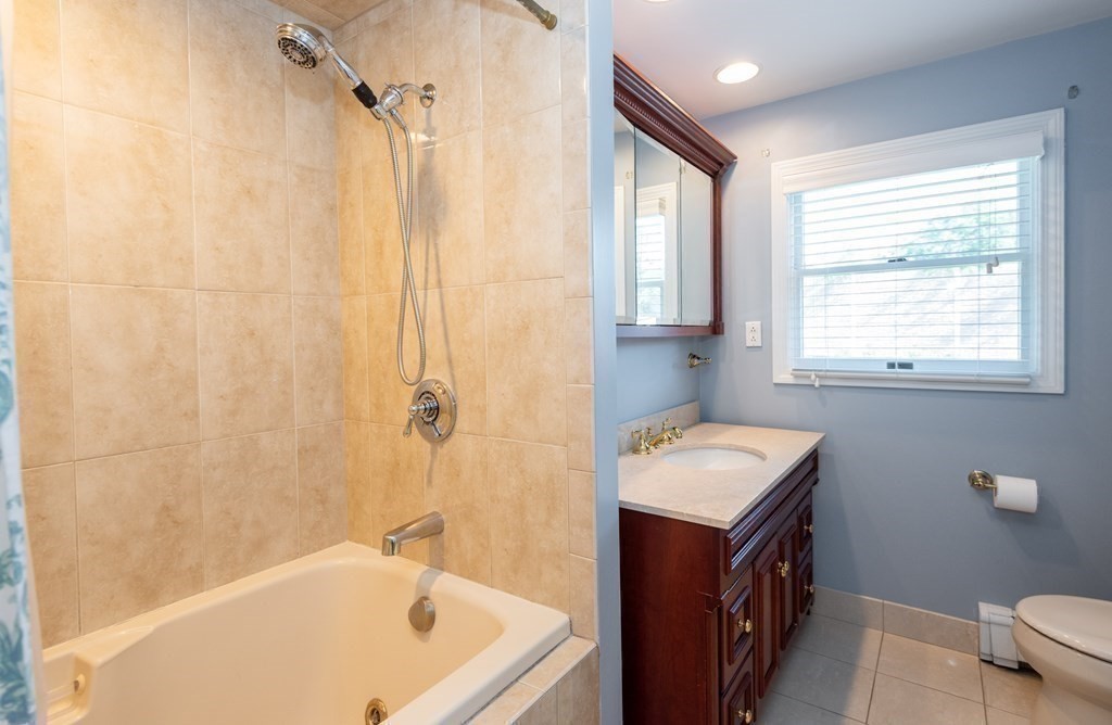 8 Pyburn Road Lynnfield, MA 01940 - Photo 20 of 35 a bathroom with a tub sink and mirror