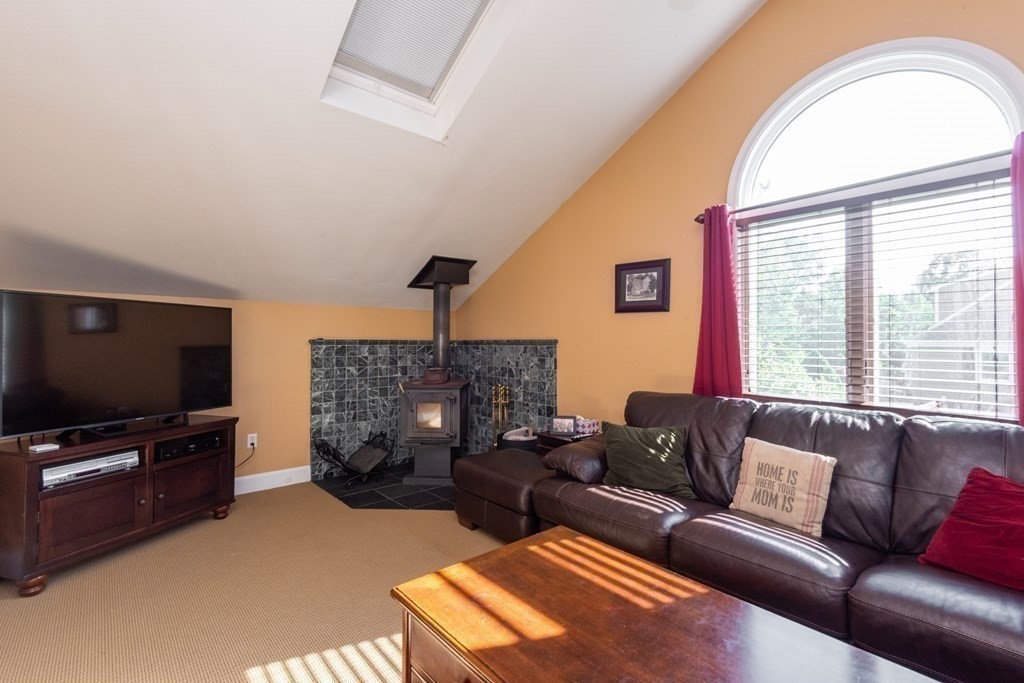 8 Pyburn Road Lynnfield, MA 01940 - Photo 9 of 35 a living room with furniture and a flat screen tv