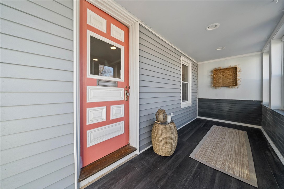 112 Ottawa Avenue Warwick, RI 02889 - Photo 3 of 25 Front Porch, with sheetrock, vinyl plank flooring and windows.