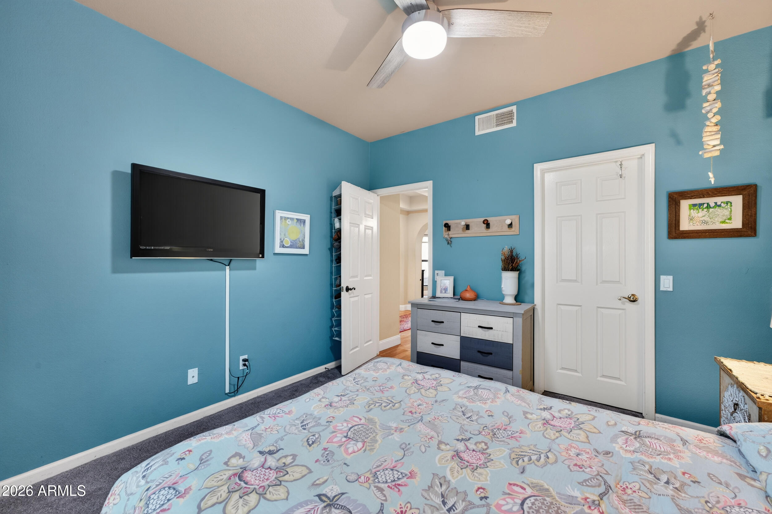 1539 East Winged Foot Road Phoenix, AZ 85022 - Photo 42 of 64 a bedroom with a bed and a flat screen tv