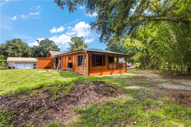 a view of balcony with wooden floor and outdoor seating