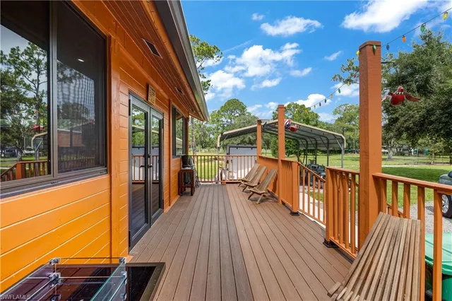 a dining table with chairs and window