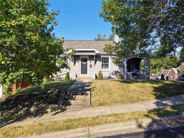 a view of a house with swimming pool and sitting area