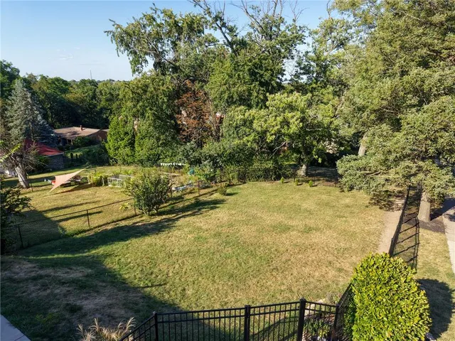 a view of a yard with an outdoor seating