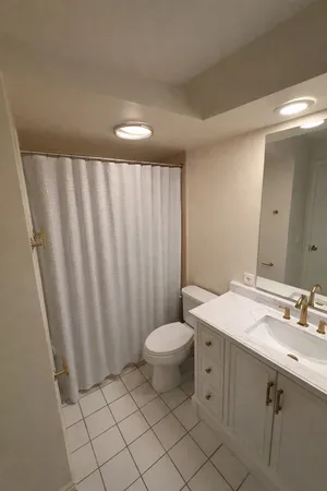 a kitchen with a sink a stove and a refrigerator