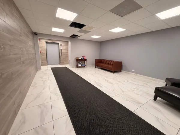 a bedroom with double bed and a couch