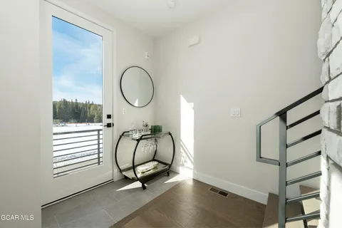 a room with gym equipment and windows