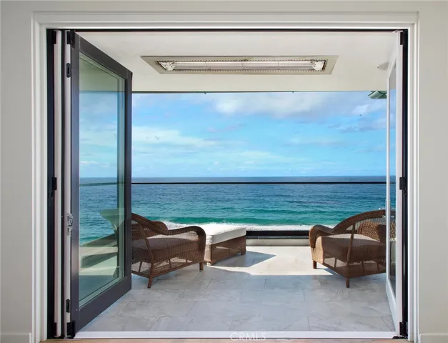 a view of a balcony with chair and table
