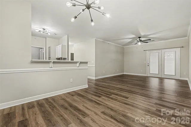 a view of a kitchen with a sink and cabinets
