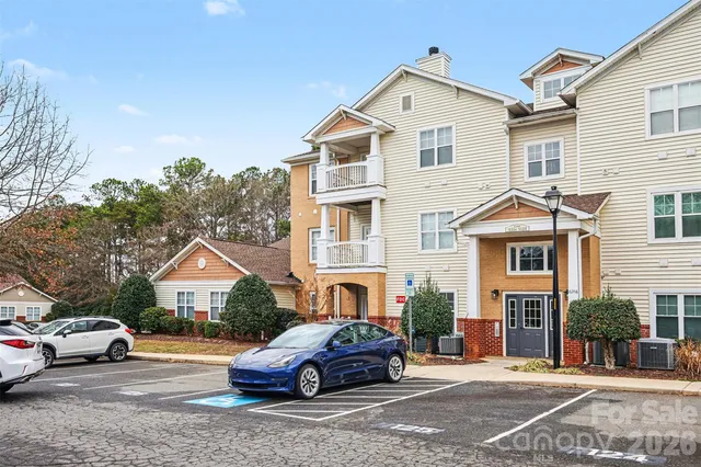 a front view of a house with parking