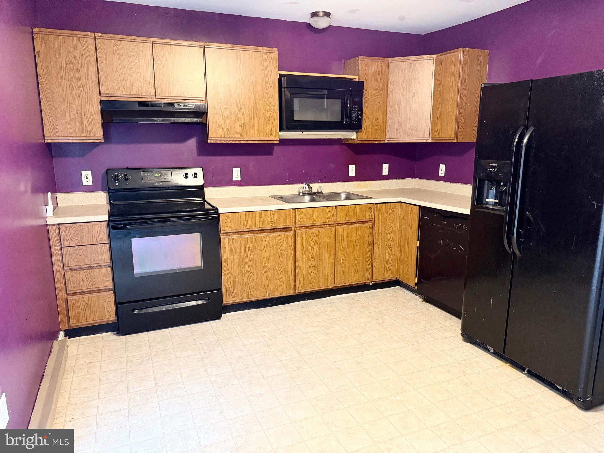 11955 Robyn Lane Princess Anne, MD 21853 - Photo 11 of 12 a kitchen with stainless steel appliances a refrigerator sink and stove