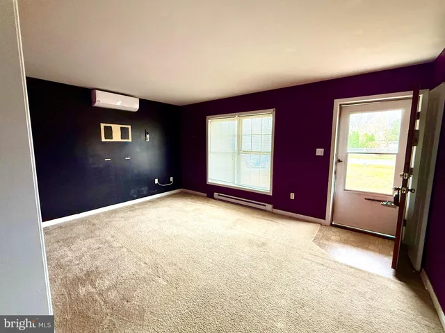 a kitchen with stainless steel appliances kitchen island granite countertop a refrigerator and a stove top oven