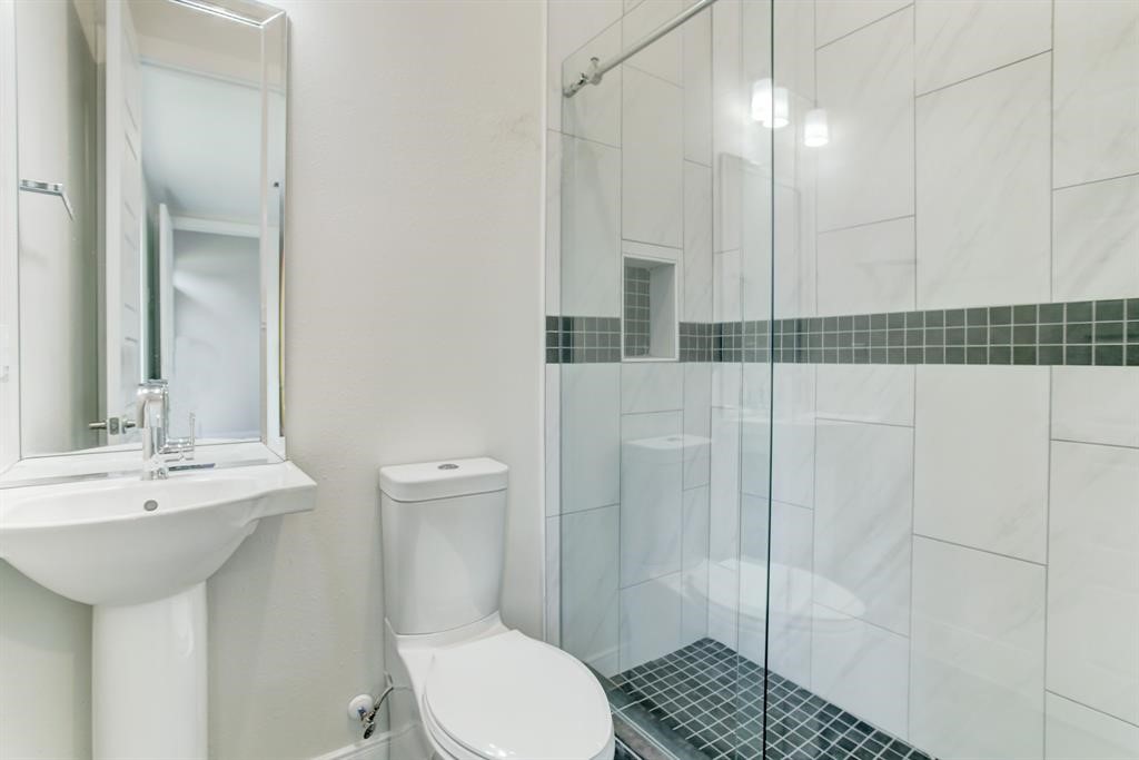 3106 Eunice Street Houston, TX 77009 - Photo 13 of 16 a bathroom with a sink a toilet and shower