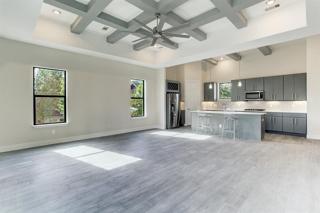 3106 Eunice Street Houston, TX 77009 - Photo 4 of 16 a large white kitchen with a large window appliances and cabinets