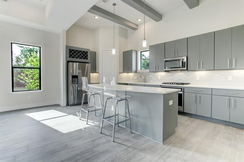 3106 Eunice Street Houston, TX 77009 - Photo 5 of 16 a kitchen with a sink cabinets and window