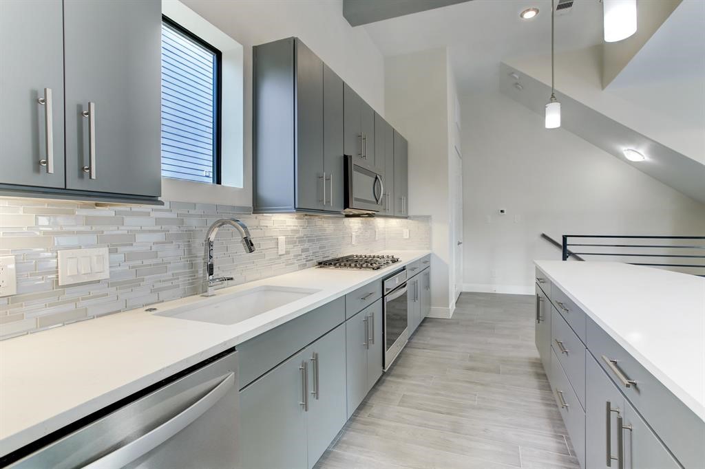 3106 Eunice Street Houston, TX 77009 - Photo 6 of 16 a kitchen with a sink and cabinets