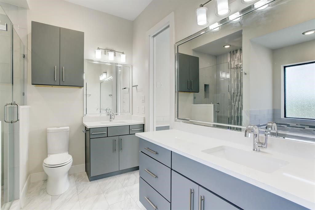 3106 Eunice Street Houston, TX 77009 - Photo 8 of 16 a bathroom with a toilet sink and mirror