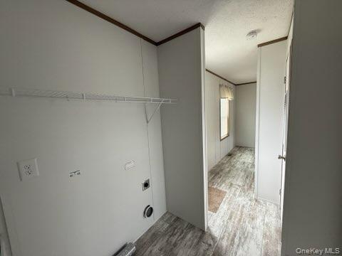 3146 Rte 9W, Unit 5A New Windsor, NY 12553 - Photo 19 of 20 Laundry room with electric dryer hookup, ornamental molding, wood finished floors, and laundry area