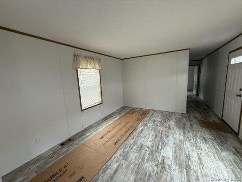3146 Rte 9W, Unit 5A New Windsor, NY 12553 - Photo 3 of 20 Spare room with crown molding and wood finished floors