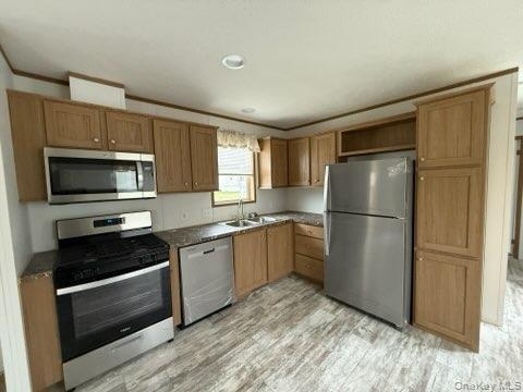 3146 Rte 9W, Unit 5A New Windsor, NY 12553 - Photo 6 of 20 Kitchen with dark countertops, open shelves, light wood-type flooring, a sink, and stainless steel appliances